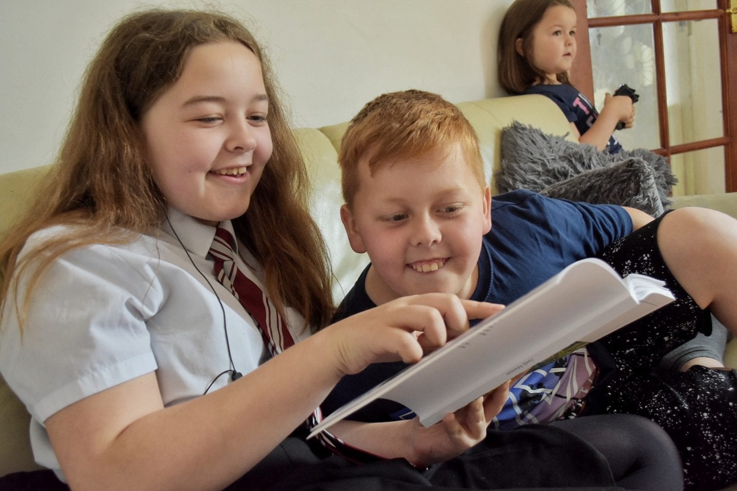 Kids looking through a photo book