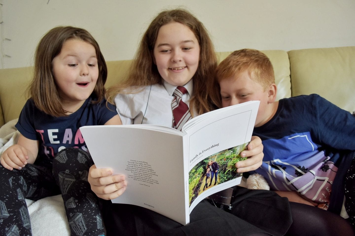 Kids looking through a photo book
