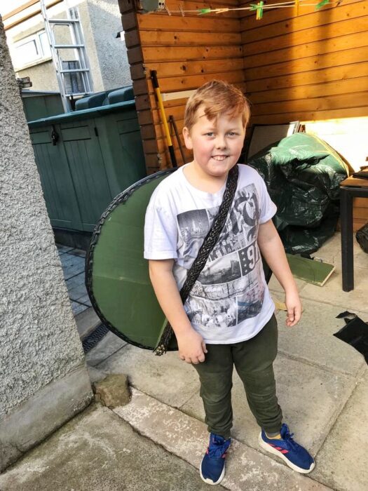 Boy holding a viking shield