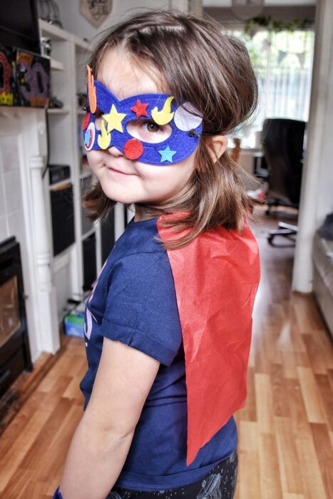 Young girl dressed as a superhero