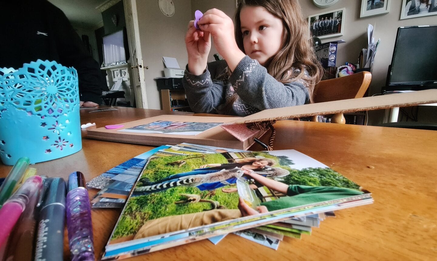 Girl making a scrapbook